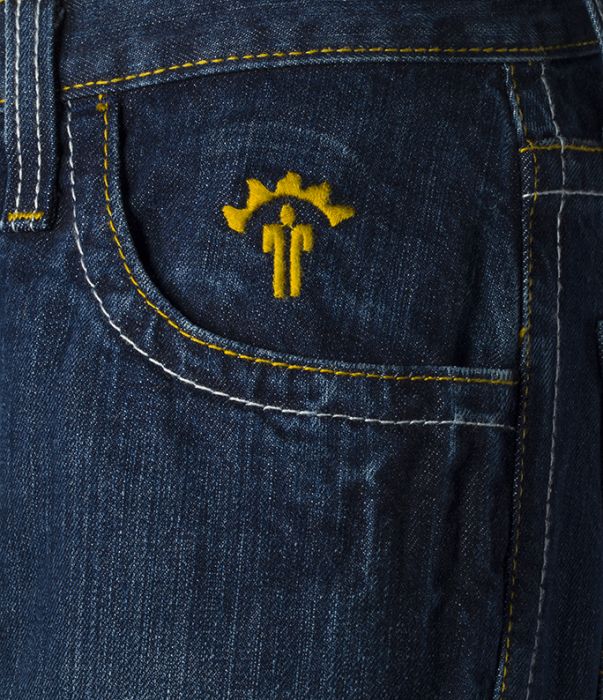 Close-up of blue jeans with yellow logo
