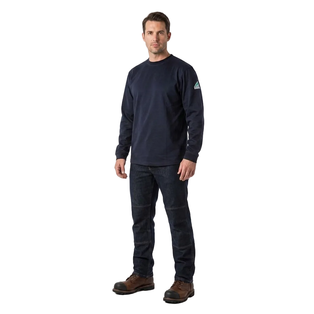 A man modeling a dark navy long-sleeve FR crewneck shirt, dark jeans, and brown work boots against a plain white studio background.