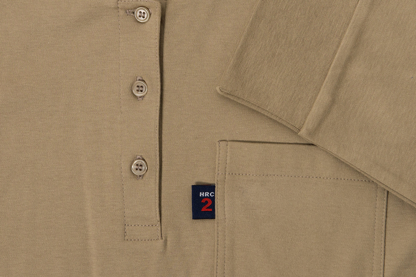 A Khaki Henley shirt. The shirt is flame-resistant and provides protection against arc flashes and other workplace hazards. It's made from a comfortable, breathable fabric and is perfect for construction, industrial, and outdoor workers.