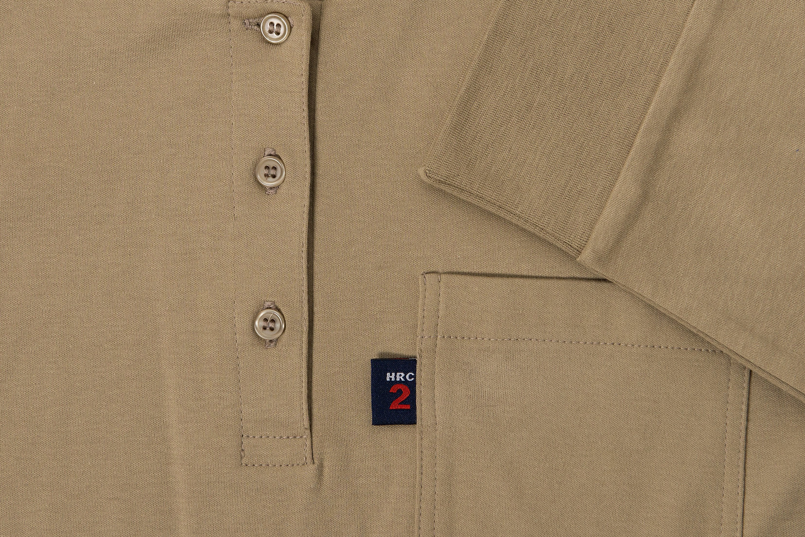 A Khaki Henley shirt. The shirt is flame-resistant and provides protection against arc flashes and other workplace hazards. It's made from a comfortable, breathable fabric and is perfect for construction, industrial, and outdoor workers.